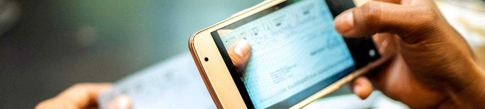 Close up of a person's hands holding a smartphone